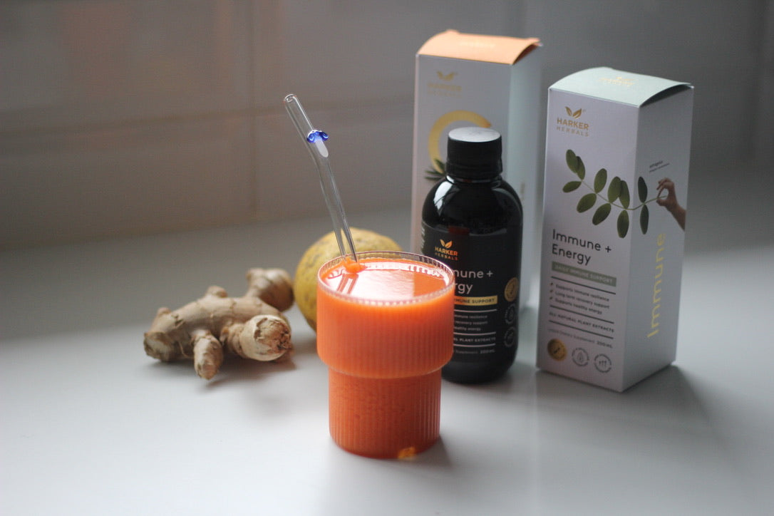 Tumeric, lemon, carrot, Sarah Tanner's Immune + Energy Juice on kitchen bench